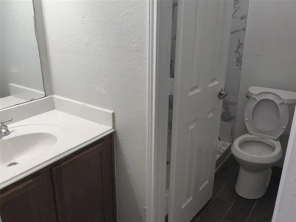 a bathroom with a sink and a toilet