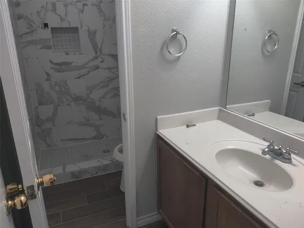 a bathroom with a sink and a mirror