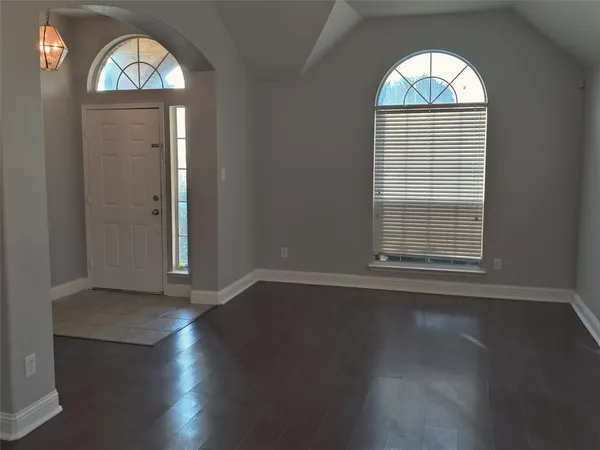 an empty room that has a window