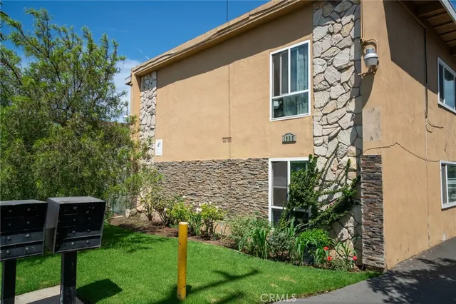 a view of a chair and table in the garden