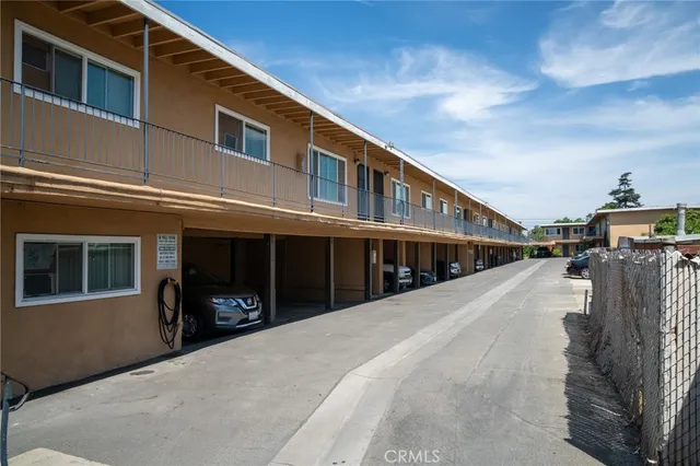 a front view of a building with many windows