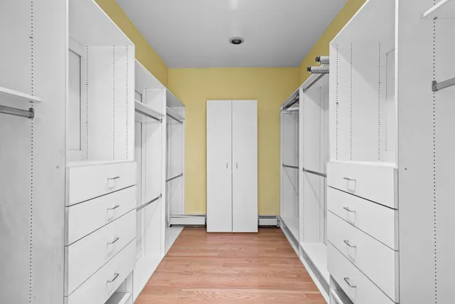 a view of a hallway with closet