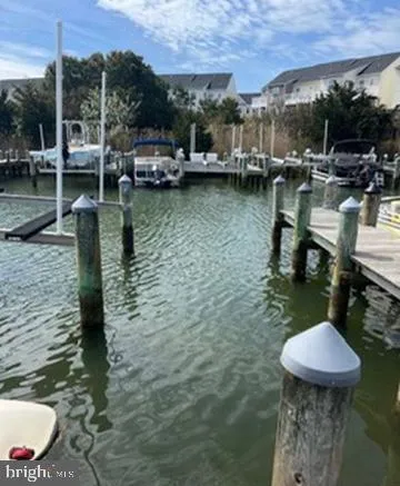 a swimming pool with outdoor seating and yard
