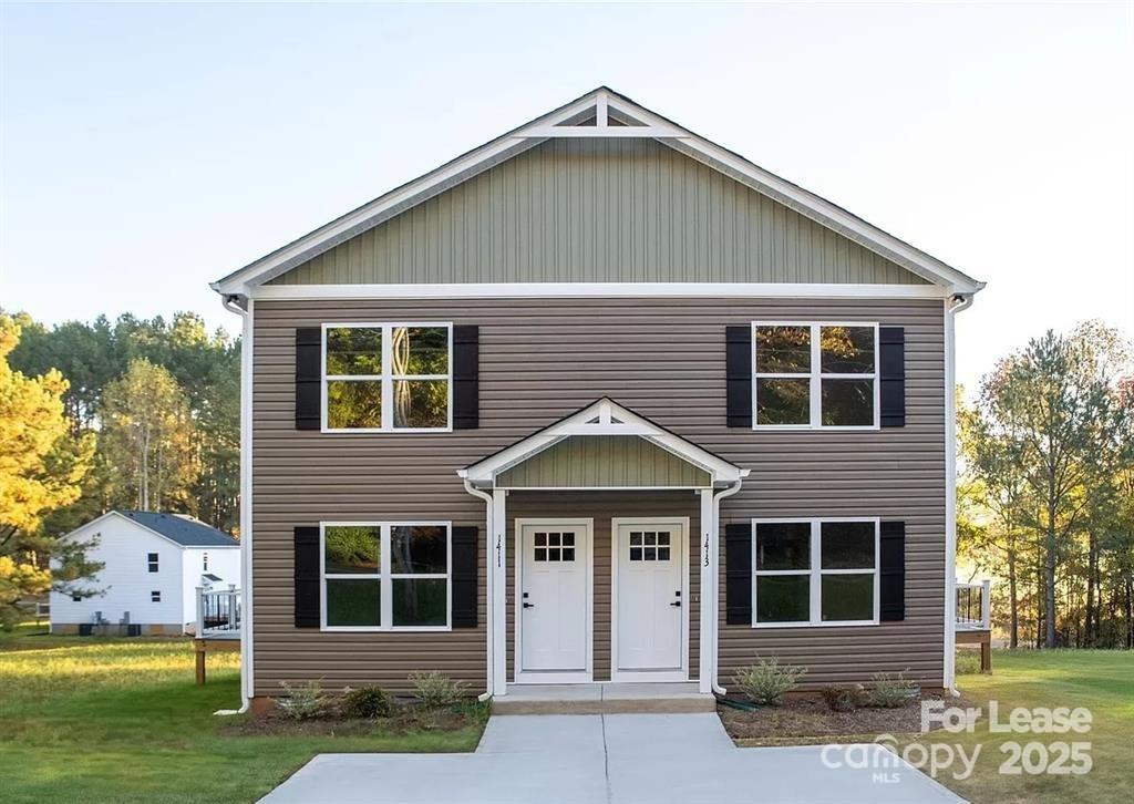 603 Edna Graves Way, Unit A Cherryville, NC 28021 - Photo 1 of 20 a front view of a house with a yard
