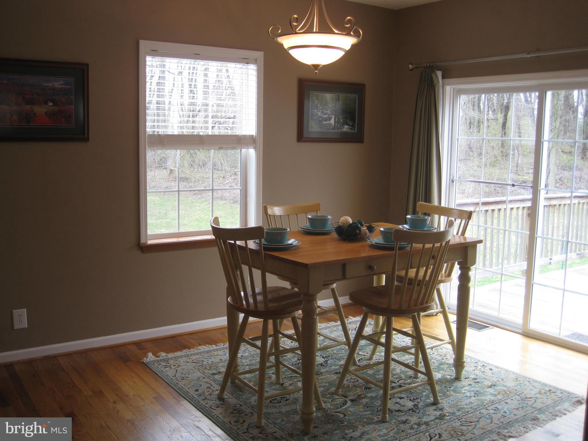 541 Stringtown Road Berryville, VA 22611 - Photo 7 of 19 a view of a dining room with furniture and window
