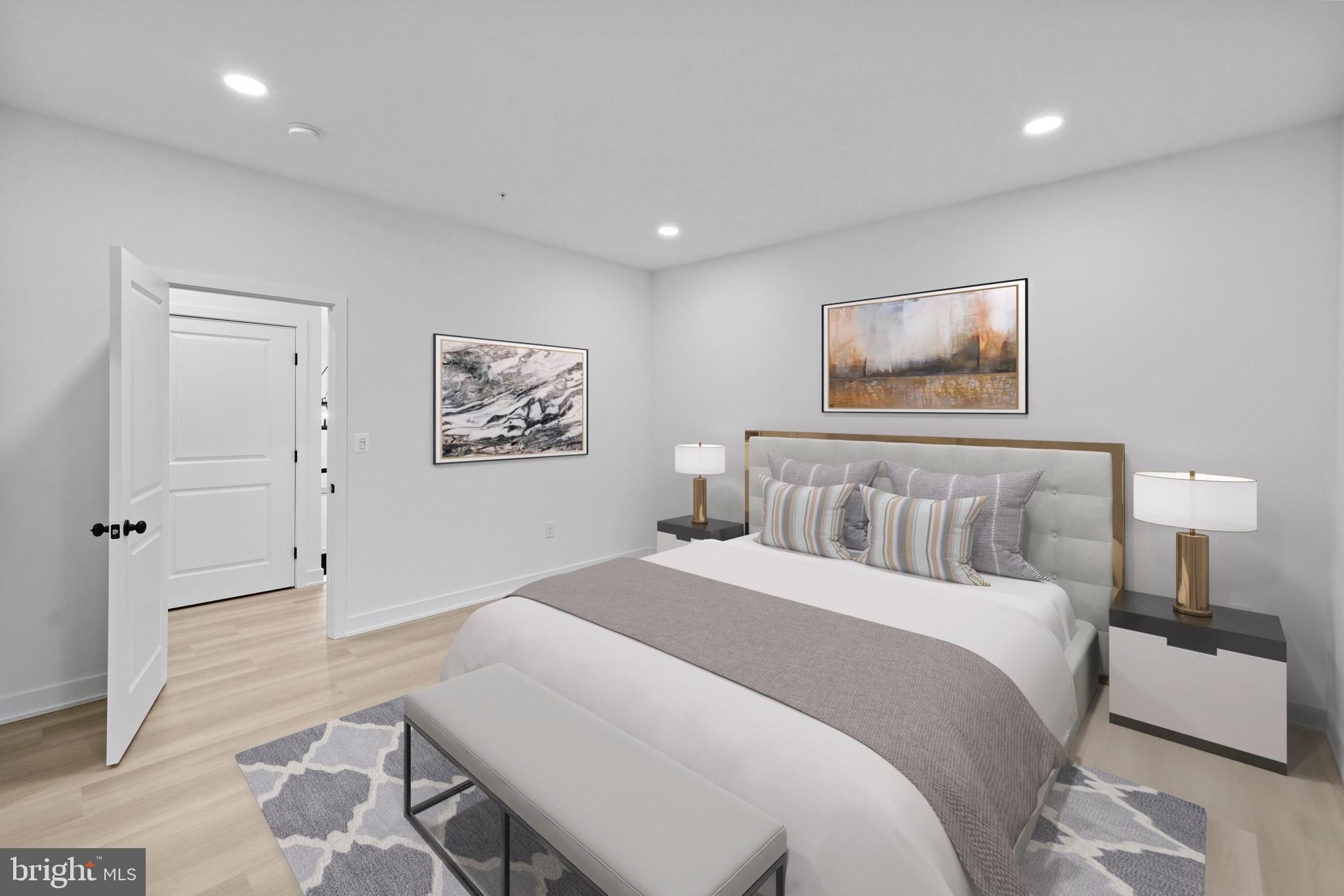 235 Brock Bridge Road Laurel, MD 20724 - Photo 11 of 59 a bedroom with a bed and a painting on the wall