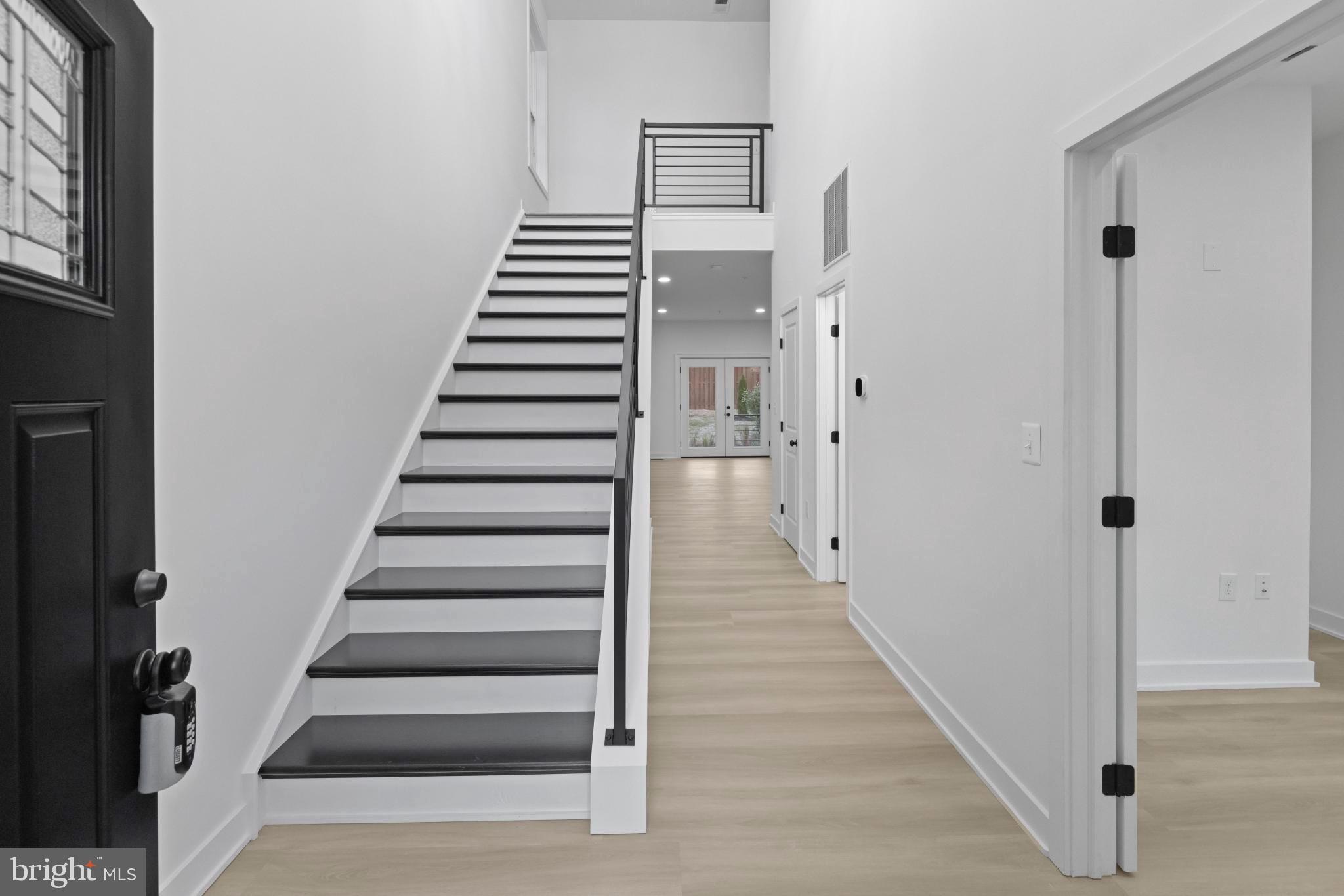 235 Brock Bridge Road Laurel, MD 20724 - Photo 17 of 59 a view of a hallway with wooden floor and entryway