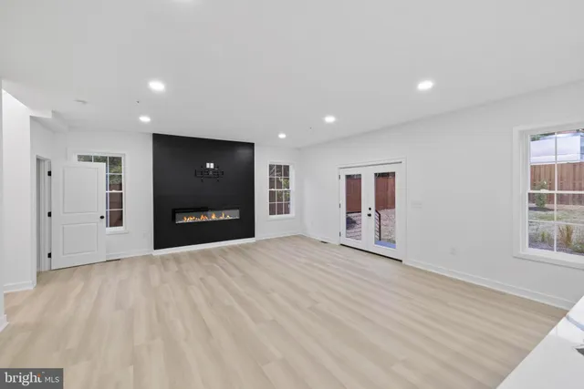 a kitchen with white cabinets sink and stainless steel appliances