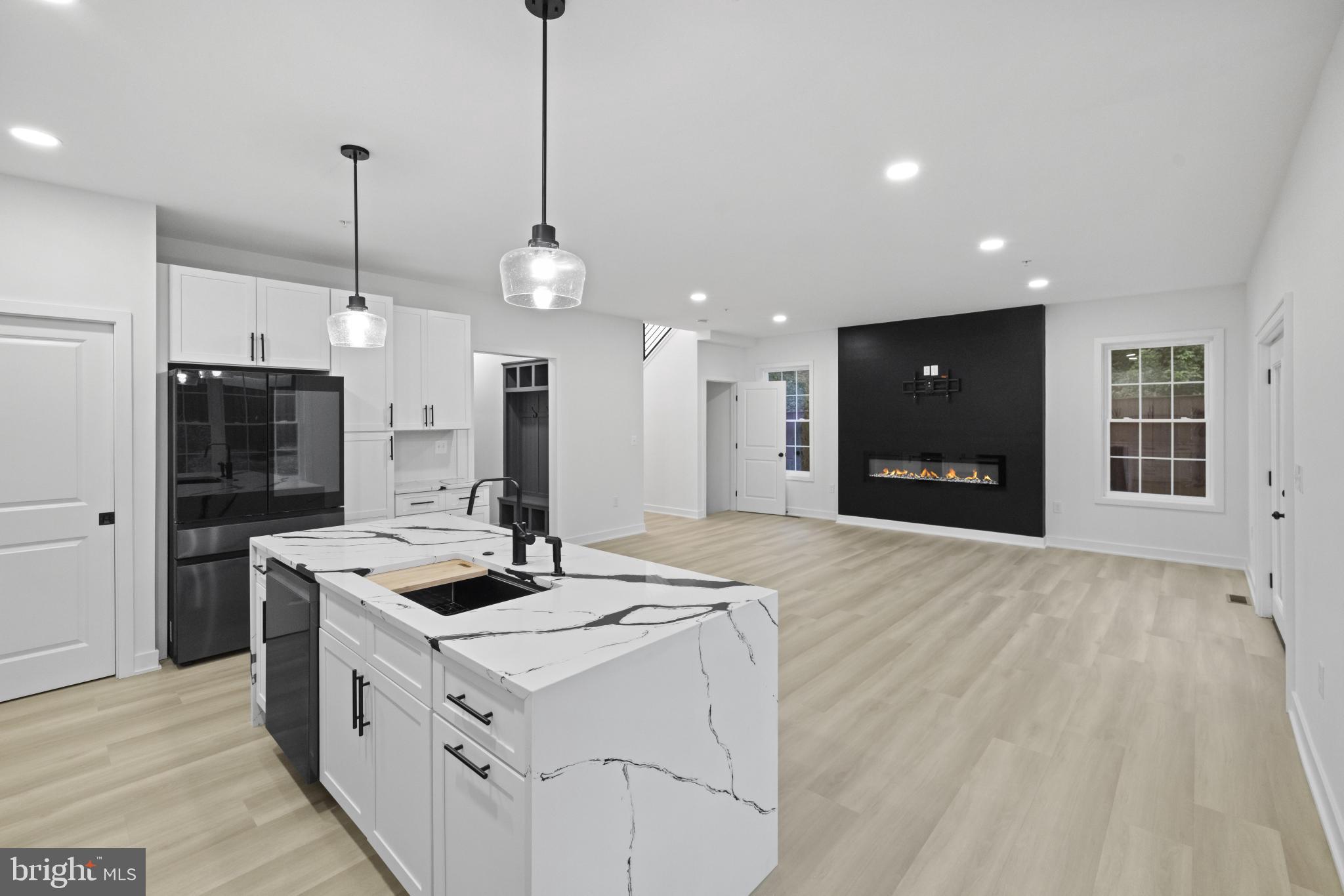 235 Brock Bridge Road Laurel, MD 20724 - Photo 22 of 59 a kitchen that has a stove a refrigerator a sink and chairs