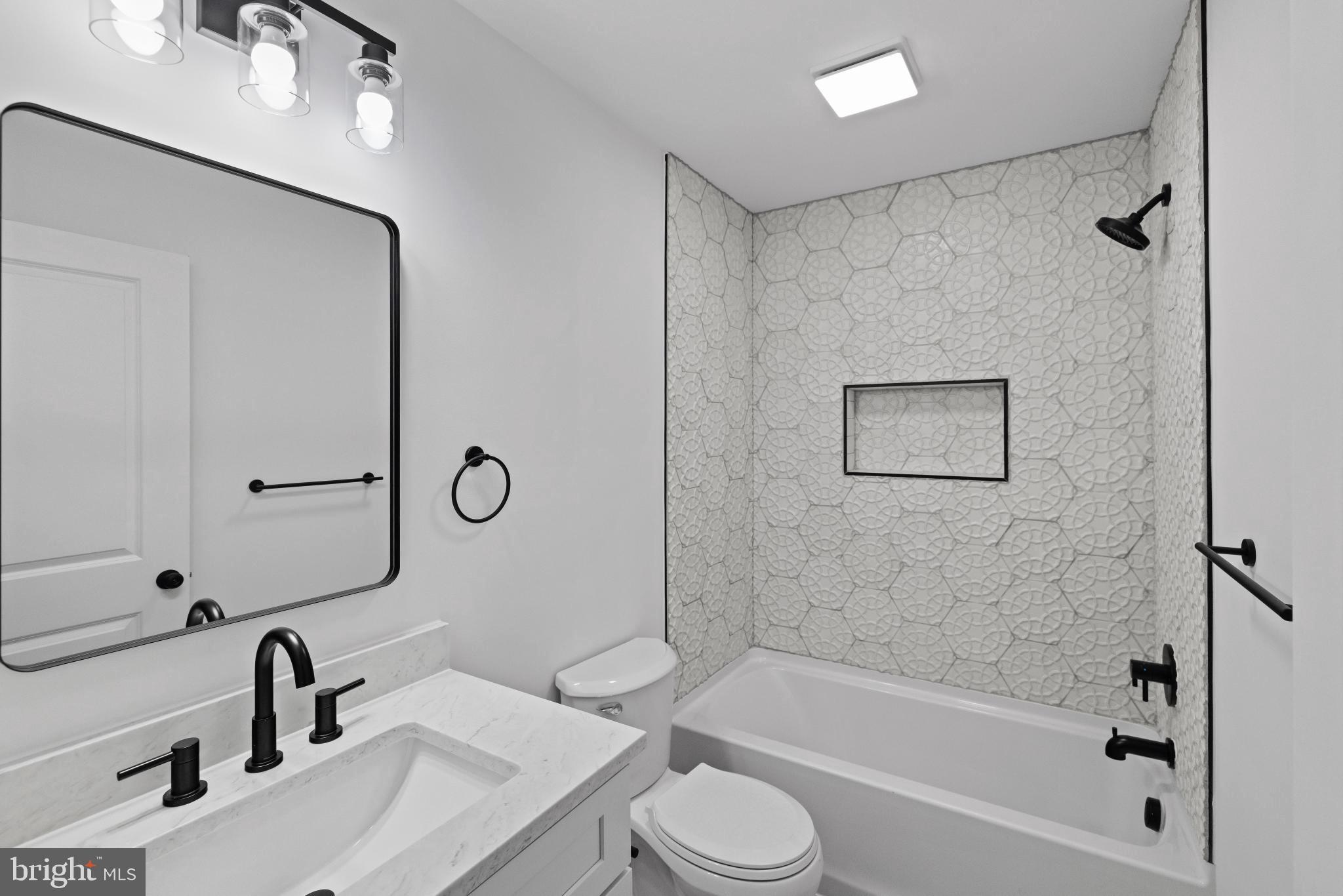 235 Brock Bridge Road Laurel, MD 20724 - Photo 26 of 59 a bathroom with a sink toilet and shower