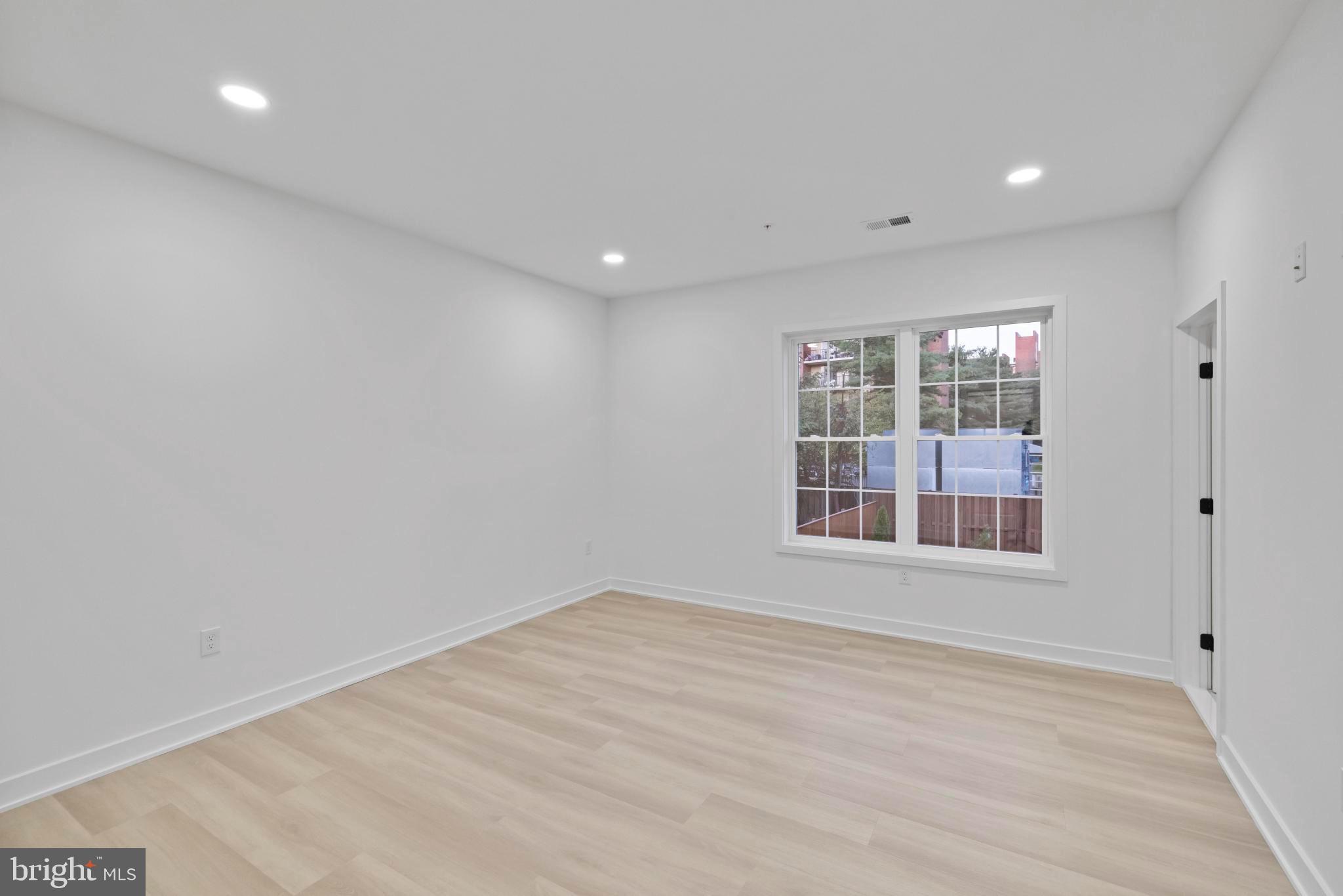 235 Brock Bridge Road Laurel, MD 20724 - Photo 35 of 59 a view of empty room with wooden floor and fan