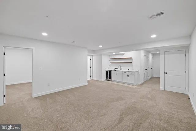 a view of empty room with windows