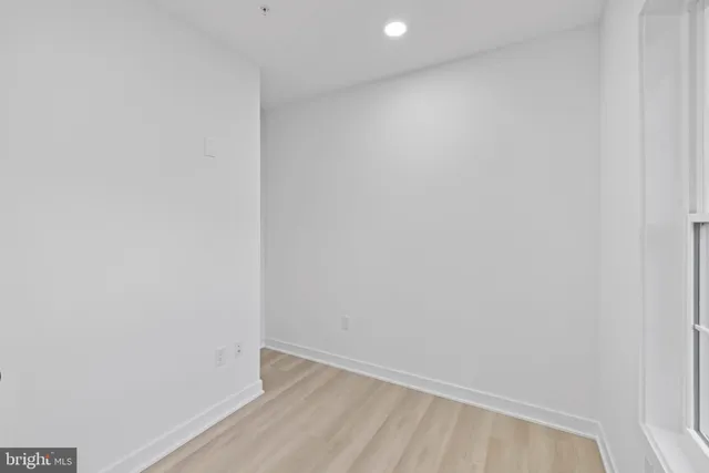 a picture of a room with a white wall and picture