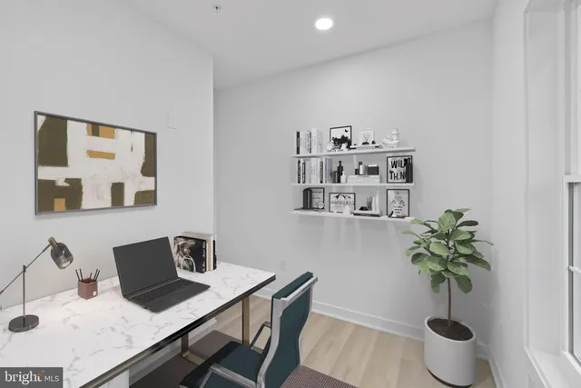 a view of a workspace with furniture