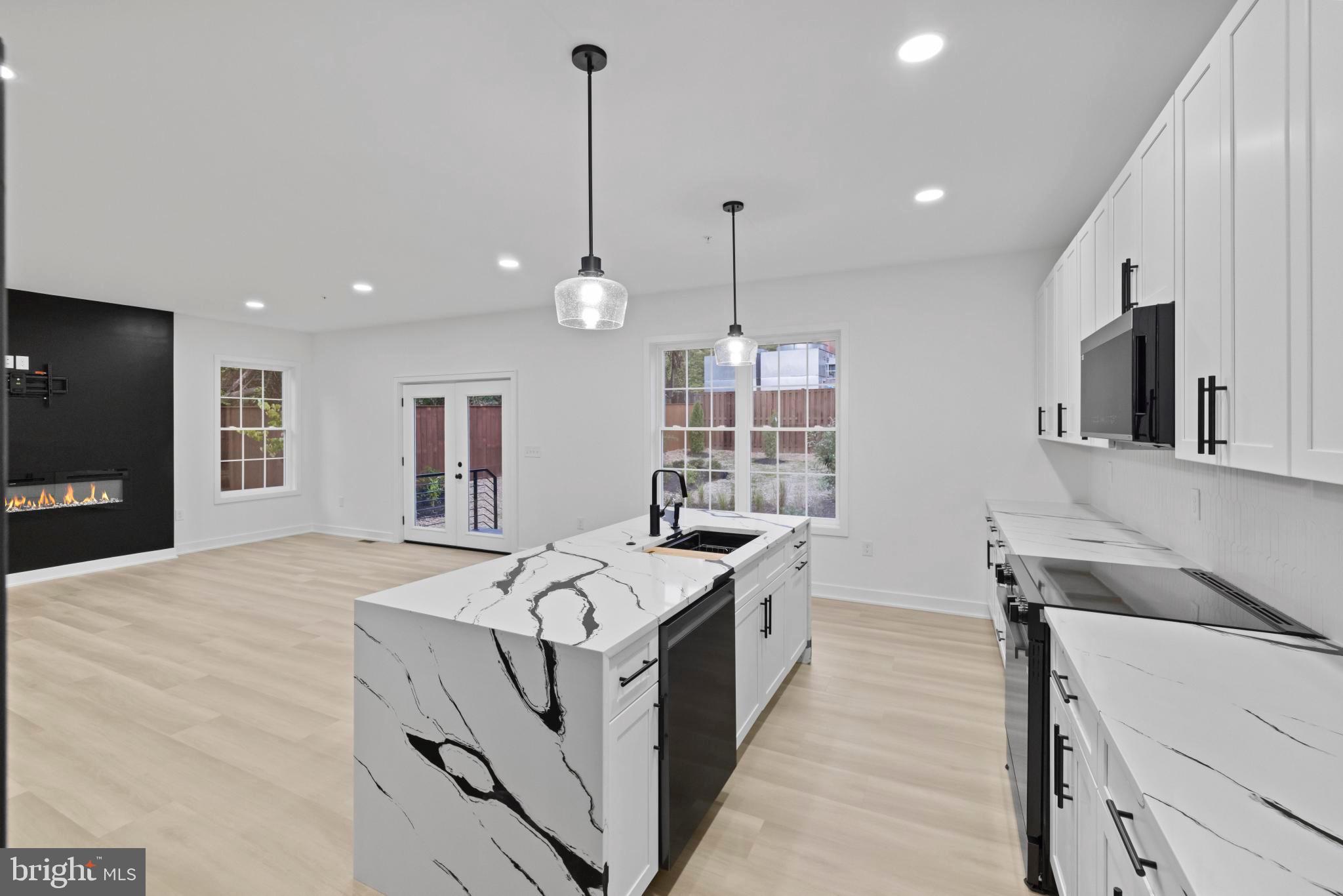 235 Brock Bridge Road Laurel, MD 20724 - Photo 10 of 59 a kitchen that has a lot of countertop furniture and a wooden floor