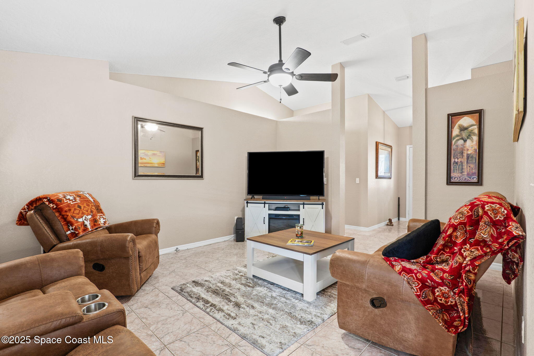 441 Southwest Avocado Avenue Sebastian, FL 32958 - Photo 11 of 30 a living room with furniture and a flat screen tv