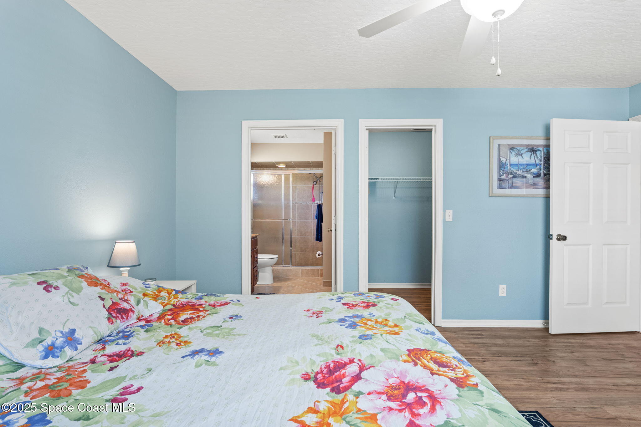 441 Southwest Avocado Avenue Sebastian, FL 32958 - Photo 19 of 30 a bedroom with a bed and wooden floor