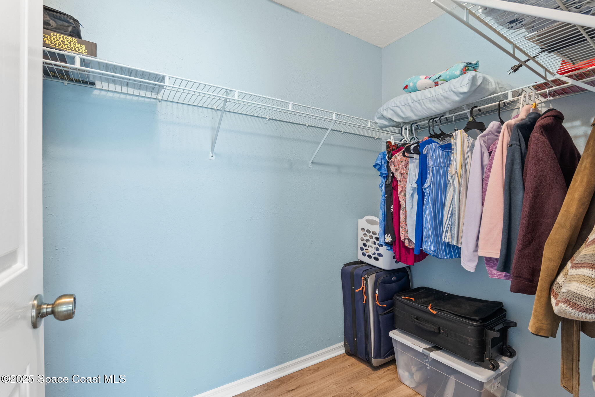 441 Southwest Avocado Avenue Sebastian, FL 32958 - Photo 21 of 30 a view of walk in closet with clothes