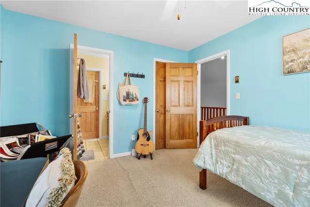 a bedroom with bed and a window