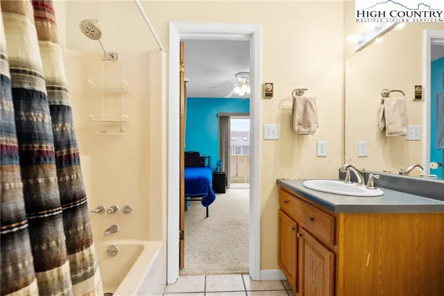 a en suite bathroom with a sink and a mirror