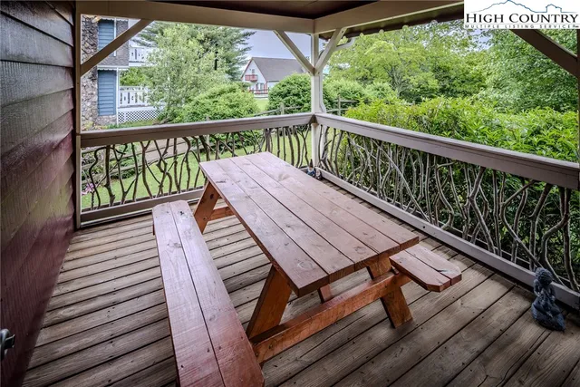 a view of a balcony with wooden floor