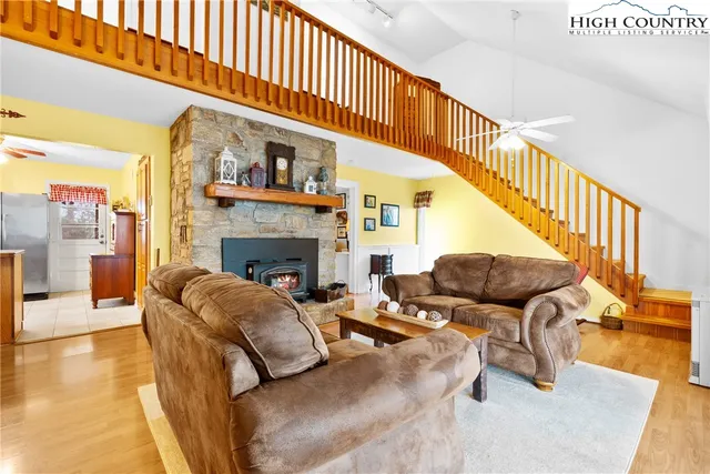 a living room with furniture fireplace and a table
