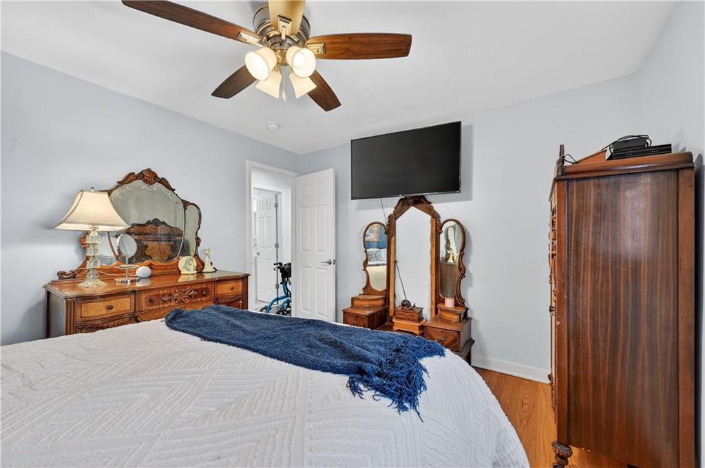 19 Locust Lane Upper St. Clair, PA 15241 - Photo 13 of 24 a bedroom with bed and tv