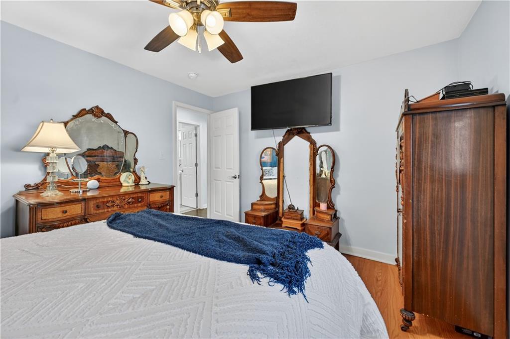 19 Locust Lane Upper St. Clair, PA 15241 - Photo 14 of 24 a bedroom with bed and flat tv screen