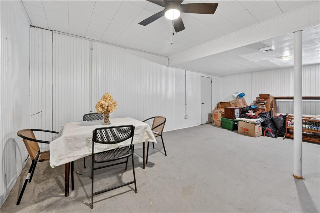 19 Locust Lane Upper St. Clair, PA 15241 - Photo 23 of 24 a dining room with furniture and a chandelier