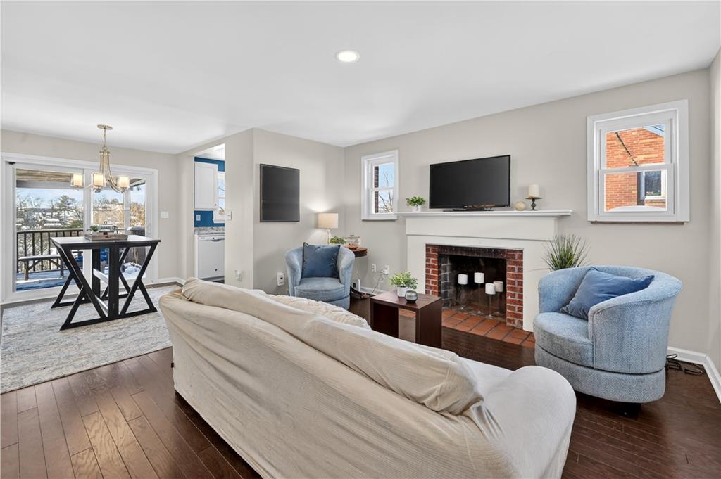 19 Locust Lane Upper St. Clair, PA 15241 - Photo 3 of 24 a living room with furniture a flat screen tv and a fireplace
