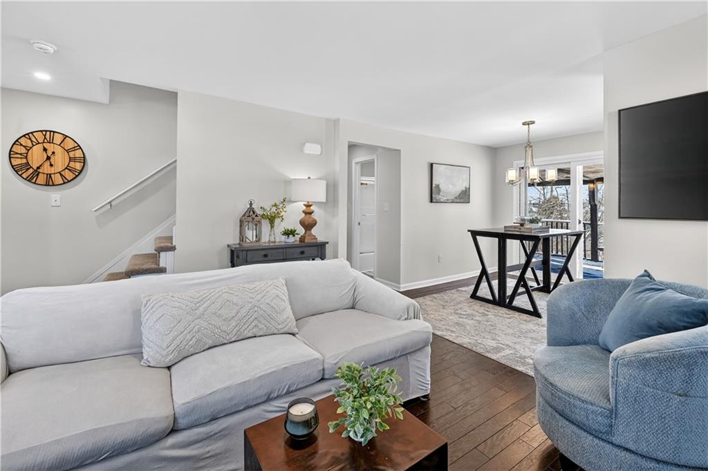 19 Locust Lane Upper St. Clair, PA 15241 - Photo 5 of 24 a living room with furniture kitchen view and a flat screen tv