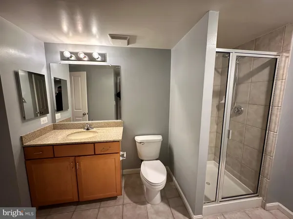 a bathroom with a toilet sink and shower