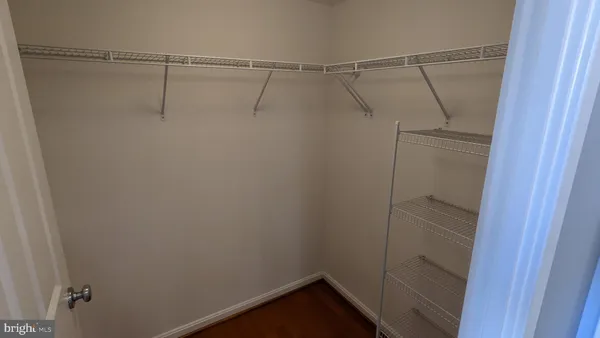 a view of a room with racks on the wall