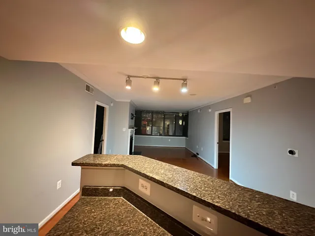 a bathroom with a tub and a large mirror