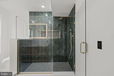 a bathroom with a shower and a sink