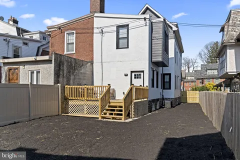 a view of a house with a street