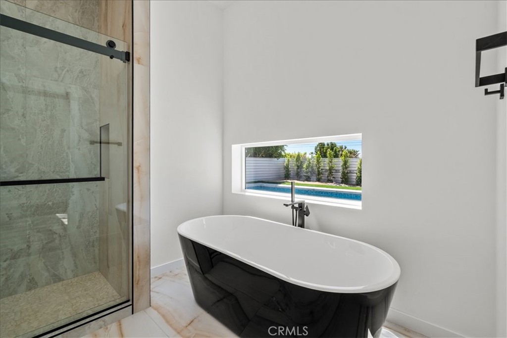 66423 San Marcus Road Desert Hot Springs, CA 92240 - Photo 15 of 28 a bathroom with a sink and a mirror