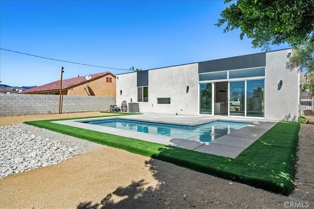 a view of a house with a swimming pool