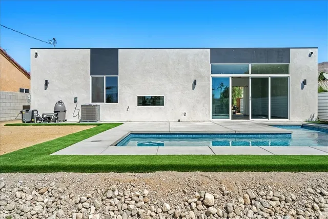 a view of a house with a swimming pool