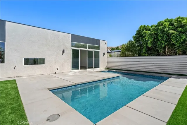 a view of a backyard with sitting area