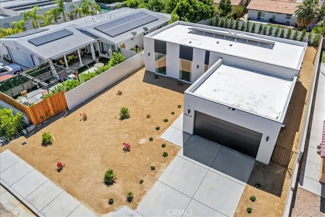 an aerial view of a house with swimming pool