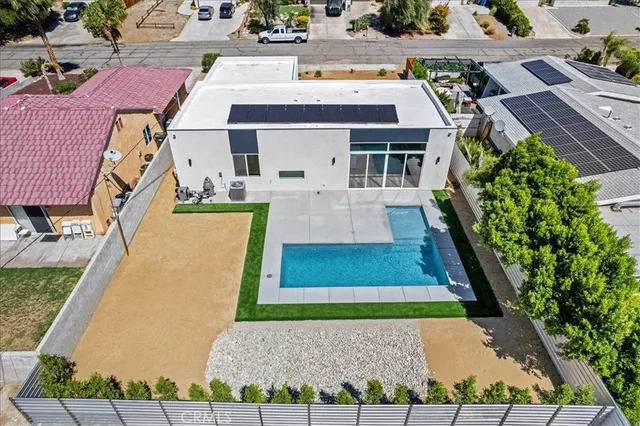 an aerial view of a house with swimming pool