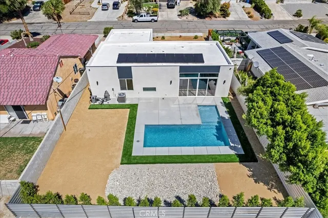 a view of a swimming pool with a yard