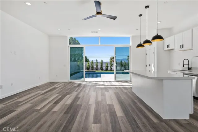 a view of kitchen with wooden floor and window