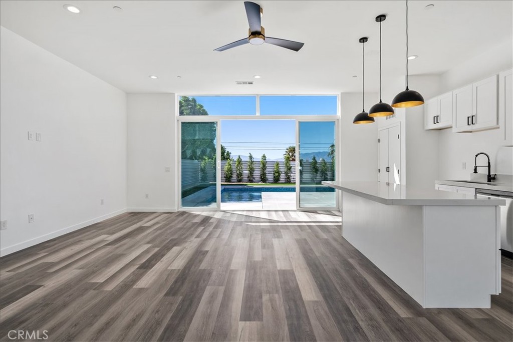 66423 San Marcus Road Desert Hot Springs, CA 92240 - Photo 7 of 28 a view of kitchen with wooden floor and window