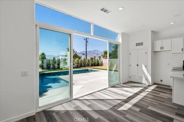 a view of a room with a furniture and floor to ceiling window