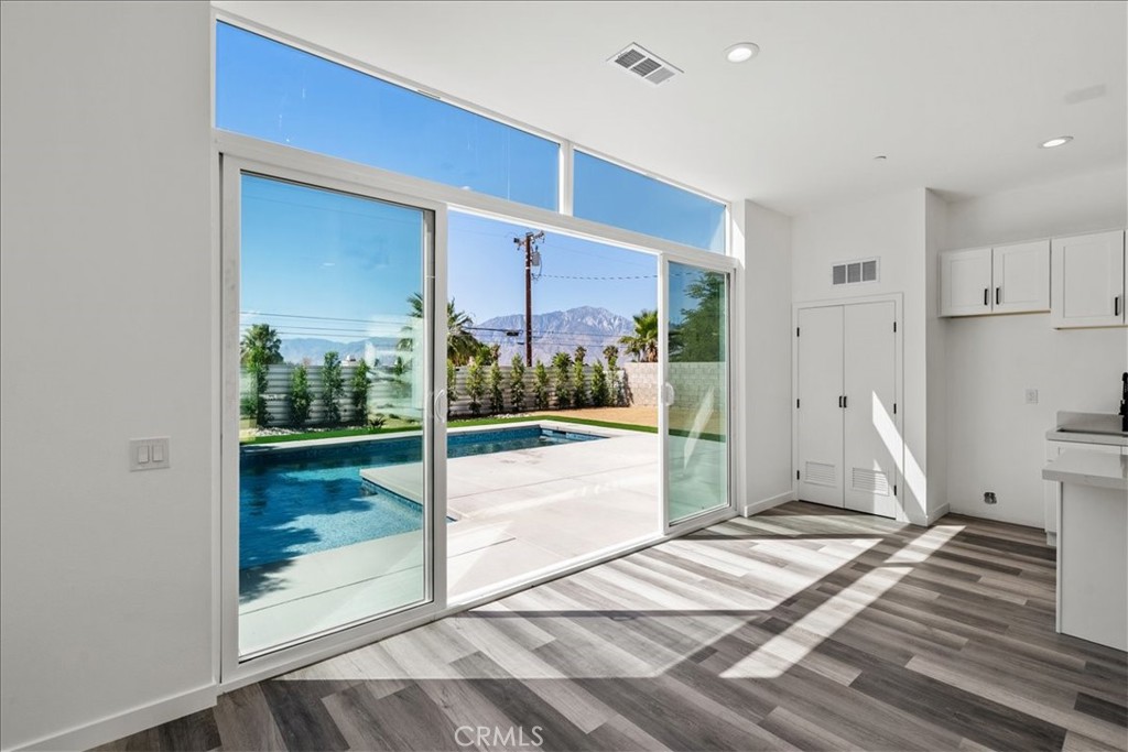 66423 San Marcus Road Desert Hot Springs, CA 92240 - Photo 9 of 28 a view of a room with a furniture and floor to ceiling window