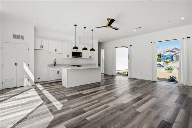 a view of kitchen with wooden floor and window