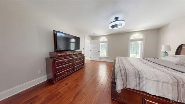 a view of a livingroom with furniture and wooden floor