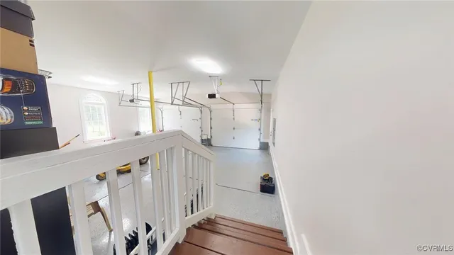 a view of a hallway with staircase